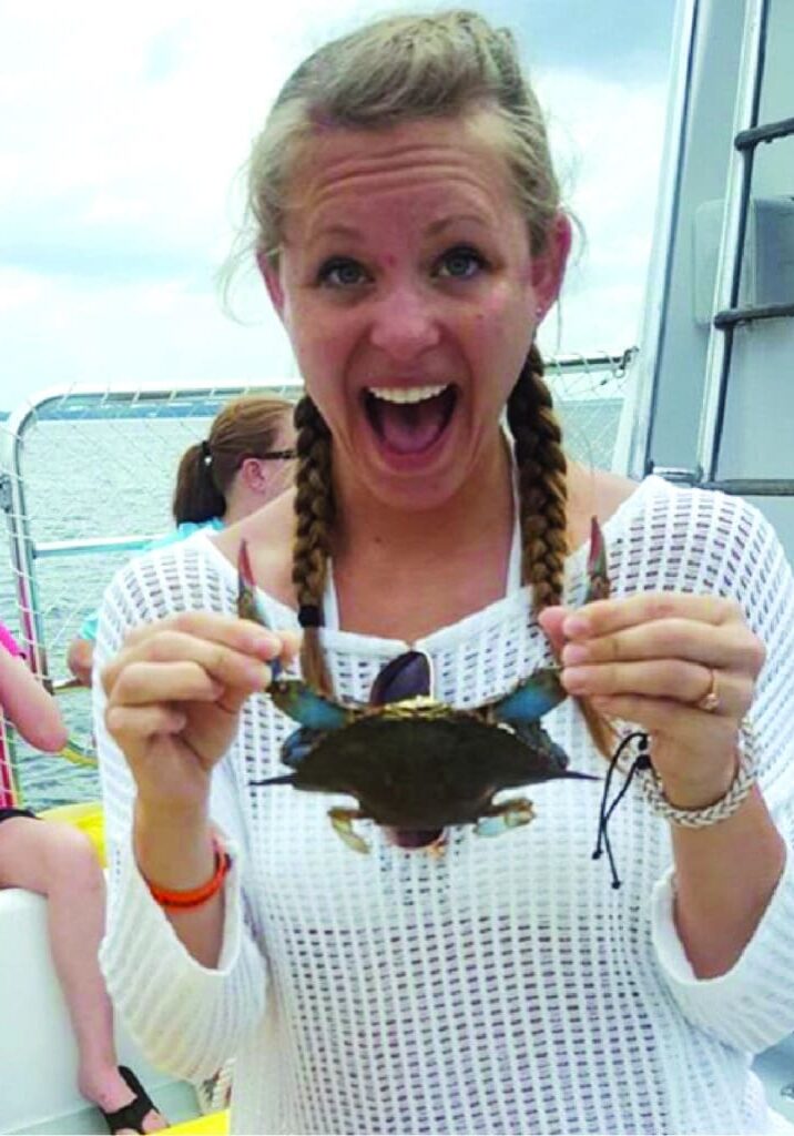 Teen Girl with Crab-The Dolphin Fun Boats
